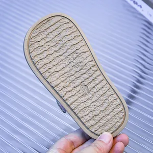 Detailed view of non-slip wavy texture and size mark on toddler sandals rubber sole