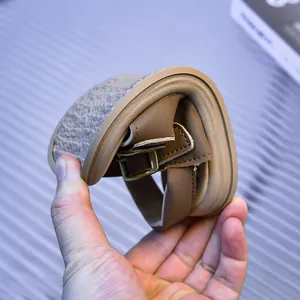 Close-up of flexible brown toddler sandal showing highly bendable soft rubber sole