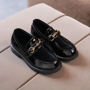 Classic black patent leather children's loafers with gold horsebit buckle and rubber sole