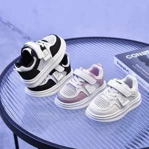 Breathable mesh children's sneakers with velcro closure in black, white and pink colors