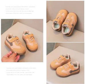 Dettaglio scarpe in pelle per bambini con velcro e suole in gomma marrone