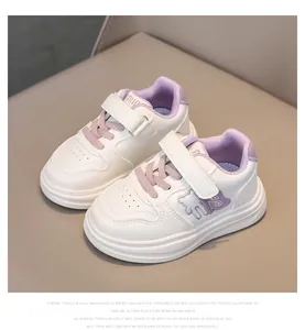 Top view of white and purple toddler sneakers with bear pattern and velcro straps