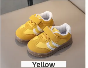 Detail view of yellow children's sneaker with velcro strap and durable rubber sole
