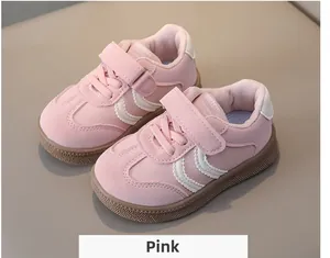 Close-up of pink toddler sneakers with velcro straps and non-slip gum soles