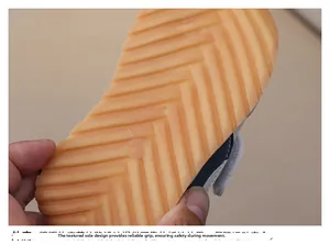 Detailed macro view of non-slip rubber outsole with herringbone patterns for kids shoes