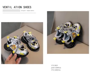 Detail view of breathable kids sneakers with silver mesh and yellow accents