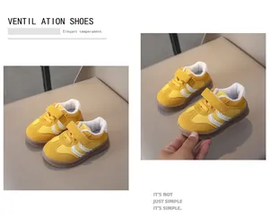 Detail view of yellow leather boys sneakers featuring breathable fabric and velcro straps