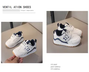 Detail of kids white sneaker with cute panda logo and secure velcro strap closure