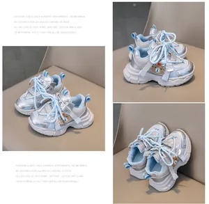 Detailed macro view of kids blue mesh sneaker featuring silver trim and a cute bear patch