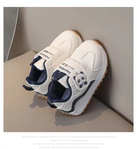 Detail of toddler sneakers with panda print, velcro strap, and anti-slip rubber sole