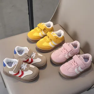 Close-up of colorful kids' sneakers with Velcro straps and non-slip rubber soles