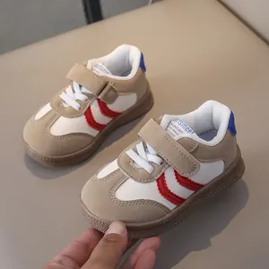 Detail of kids casual sneaker with hook-and-loop closure and beige synthetic upper