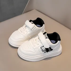 Kids minimalist white and black casual sneakers with cute bear design and velcro straps