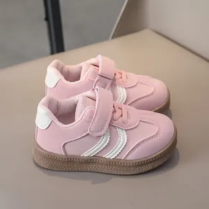 Detailed close-up of pink toddler sports shoe with velcro strap and non-slip rubber sole