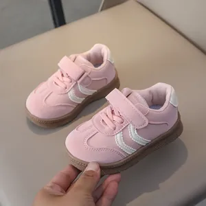 Detail of pink toddler sneaker with non-slip rubber sole and velcro strap closure