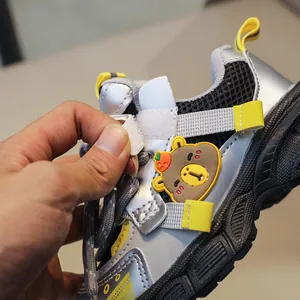 Close-up of kids running shoes showing hook-and-loop closure for easy wear and take off