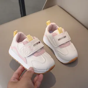 Close-up of kids' winter sneakers with velcro straps and cute rabbit embossing detail