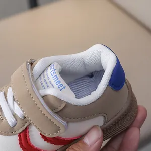 Detail of breathable mesh lining and padded heel on khaki leather kids' sneakers