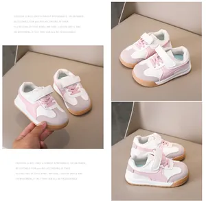 Detail showing toddler sneakers with velcro straps and anti-slip rubber gum soles