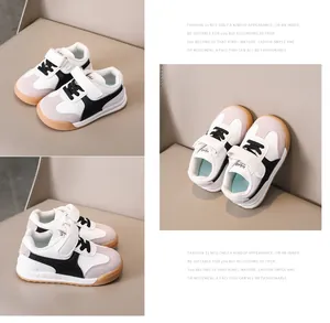 Detailed top view of kids sneakers featuring velcro closure and non-slip rubber soles