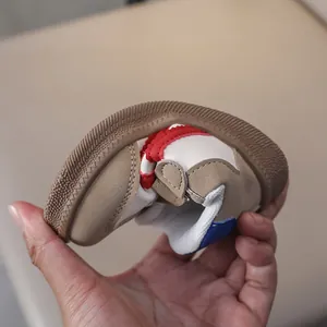 Close-up showing the flexible rubber sole and soft leather of these toddler sneakers