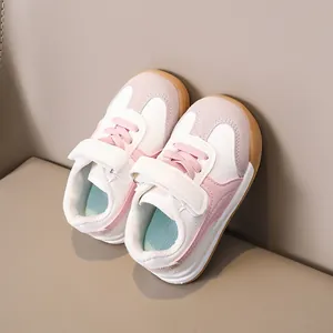 Detail of kids sneaker showing velcro closure and durable non-slip gum rubber sole