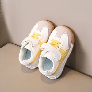 Detail view of children's low-top sneakers with Velcro strap and non-slip rubber soles