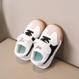 Close-up of kids retro trainers showing synthetic leather texture and gum rubber sole
