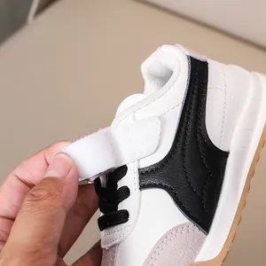 Detail of kids' athletic sneaker with velcro closure and durable leather texture