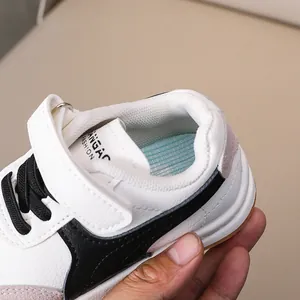 Detail of kids sneaker with dual closure, mesh lining and honeycomb breathable insole
