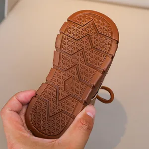 Close-up of durable non-slip rubber sole with size 23 mark for children boots
