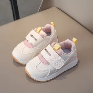 Pink and beige toddlers sneaker with cartoon rabbit motif and velcro closure