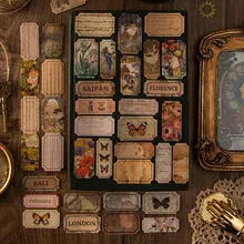 Close-up of vintage floral and butterfly postcards with decorative retro collage items