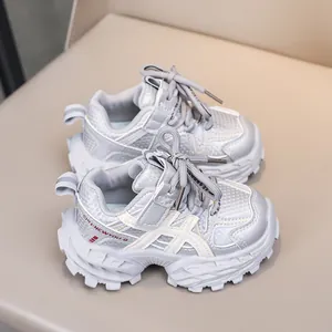 Close-up of children's mesh sneakers with silver leather and thick rubber soles