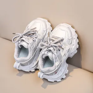 Close-up of children's breathable chunky sneakers with soft soles and mesh texture