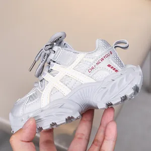 Close-up of children's grey mesh sneakers with thick non-slip soles and retro design