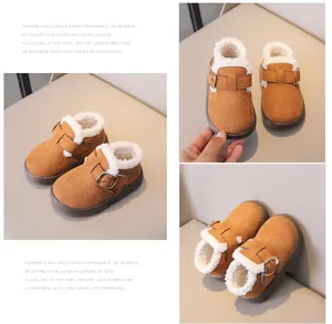 Detail view of children's warm brown suede boots with thick fleece lining and buckle