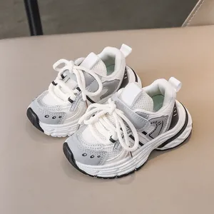 Kids' white and grey leather sports shoes with mesh detail and durable thick soles