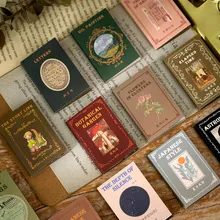 Flat lay of retro aesthetic film and poetry stickers with vintage newspaper backdrops