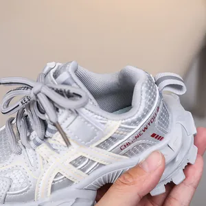 Close-up of kids sports shoes showing breathable mesh texture and non-slip gear sole