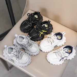 Kids chunky sneakers in black, silver, and white with breathable mesh and thick soles