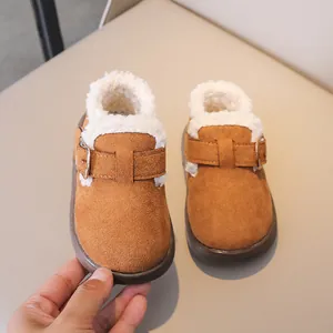 Detail of warm winter toddler shoes with plush faux lamb wool lining and suede texture