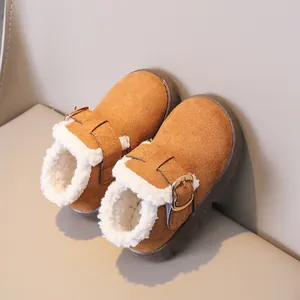 Detailed close-up of kids' winter boots with faux shearling lining and suede finish