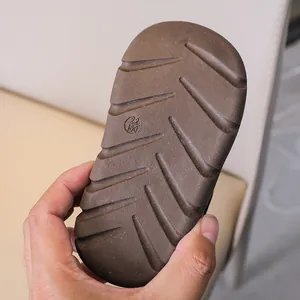 Detailed view of the anti-slip rubber sole with texture and size marking on children shoes
