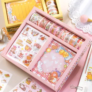 Close-up of cute pink stationery set with cartoon bear tapes and matching stickers