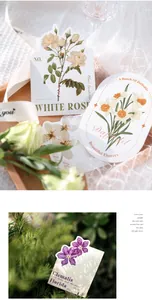 Detail of vintage floral art cards with die-cut edges showing white rose and clematis
