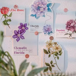 Artistic watercolor floral postcard set featuring roses and clematis in box packaging