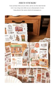Macro detail of retro travel washi stickers with European cafe and red bus designs
