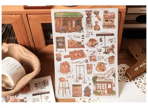 Close-up of vintage coffee-themed hand-drawn stickers for journals and scrapbooking