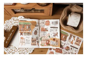 Macro shot of vintage cafe-themed washi stickers and decorative scrapbooking tapes
